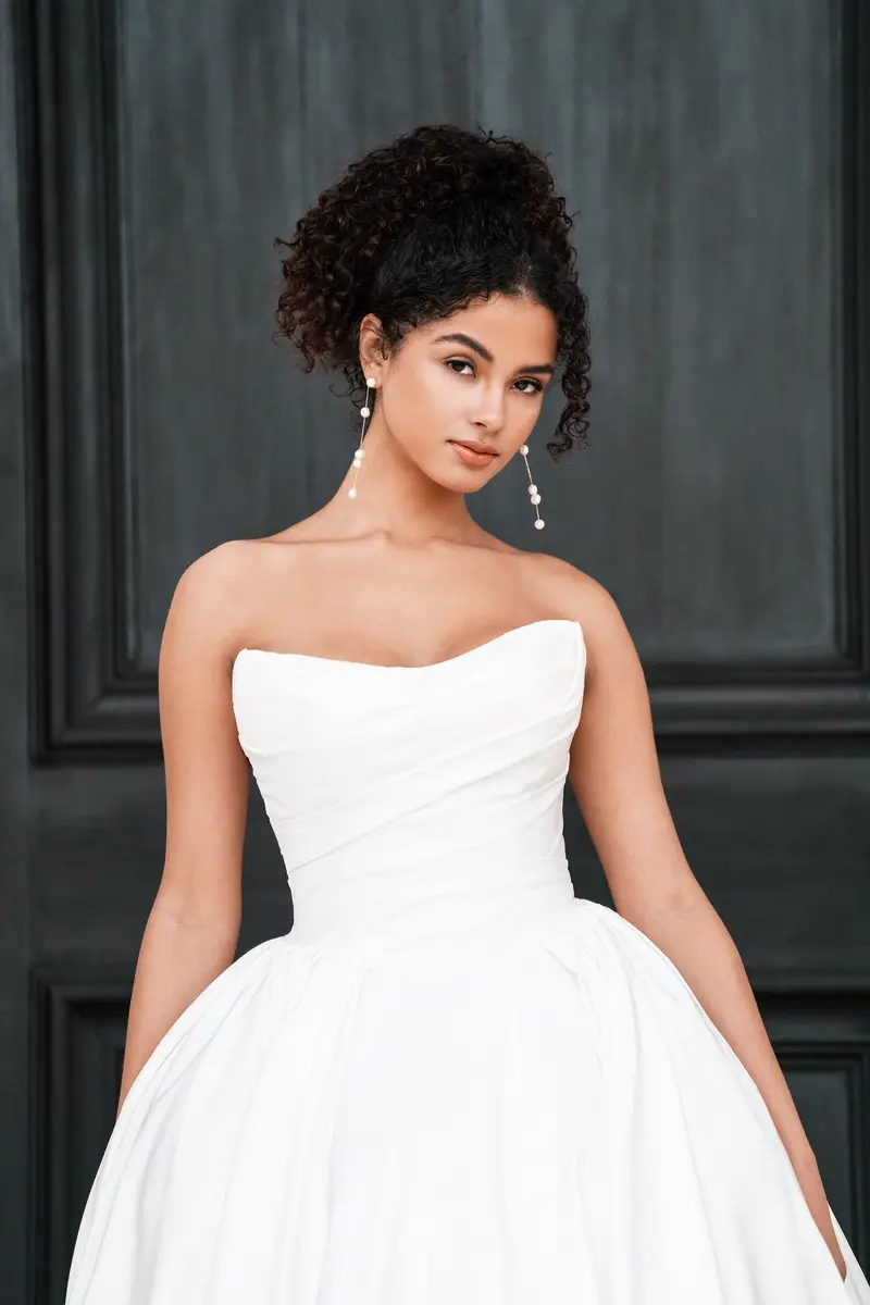 Allure Bridals style A1359 gown hanging on the sales floor at Cande Bridal Boutique