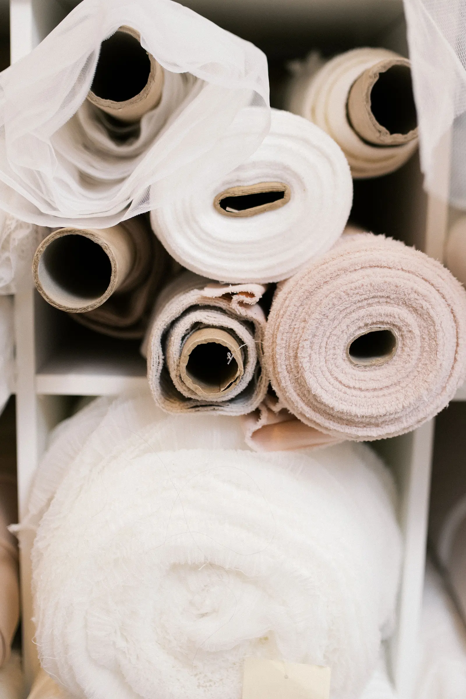 Ivory bridal fabric, lace and beading photographed in close detail at Cande Bridal Boutique in Kelowna, British Columbia