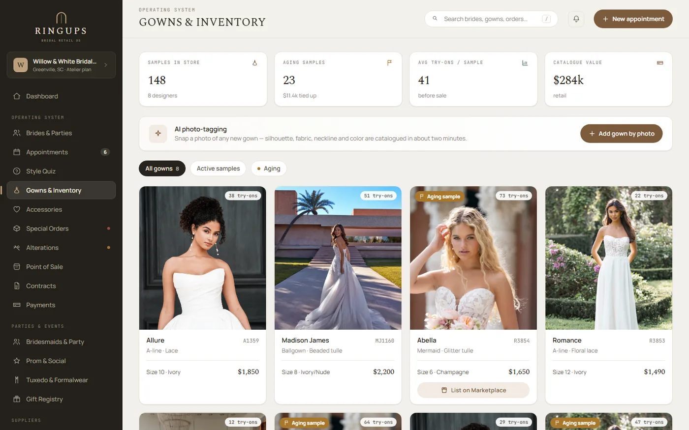 RingUps Gowns & Inventory screen showing stat tiles for samples in store, aging samples and catalogue value, an AI photo-tagging prompt, and a grid of gown cards with designer, style number, size, price and try-on counts